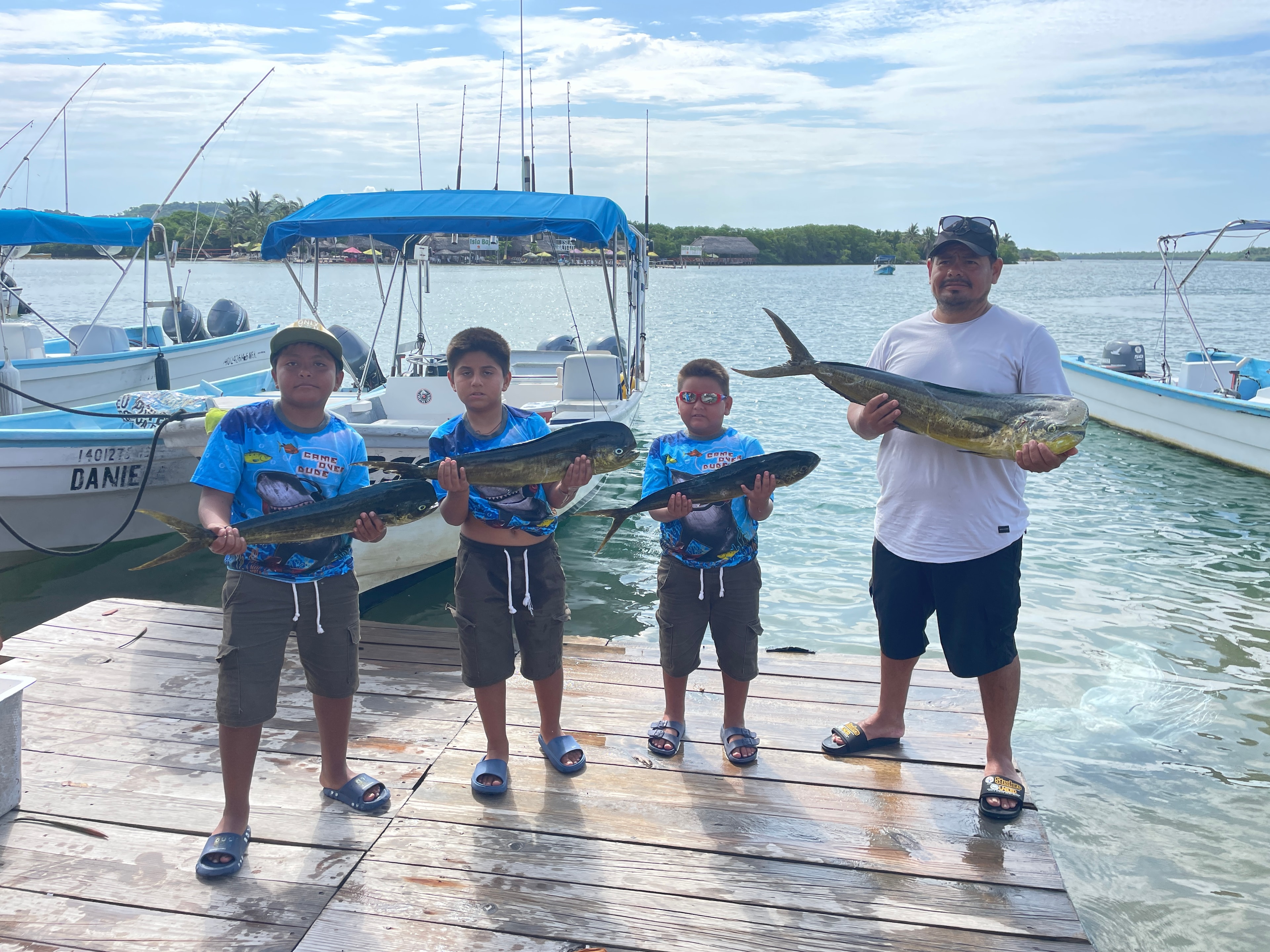 Fishing charter guests posing with their catch